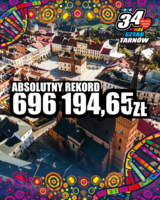 WOŚP - zdjęcie Tarnowa, dookoła kolorowe rysunki, w środku kwota 696 tysięcy zł